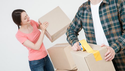 Prepared boxes and furniture ready for moving van collection in Sutton