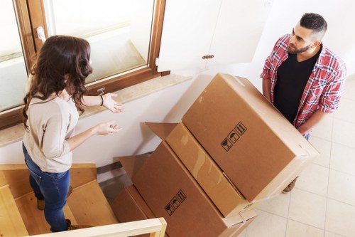 Office furniture and boxes organised for delivery to a new Sutton workplace