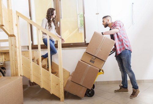Moving van loading outside a Sutton property